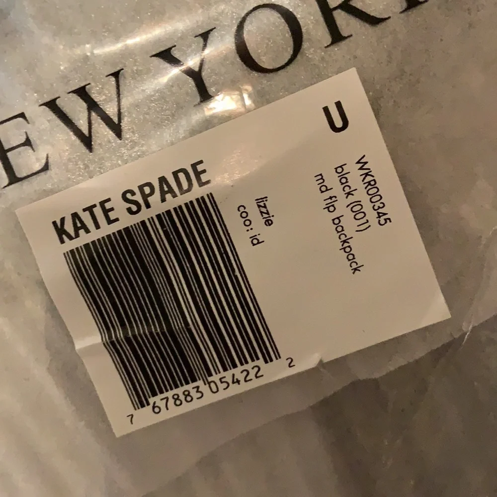 14. Kate Spade Lizzie Medium Flap Backpack in Black